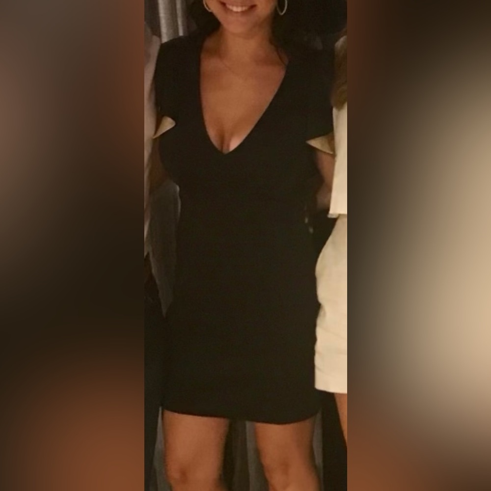 Black dress with gold lining and open lower back. Size medium